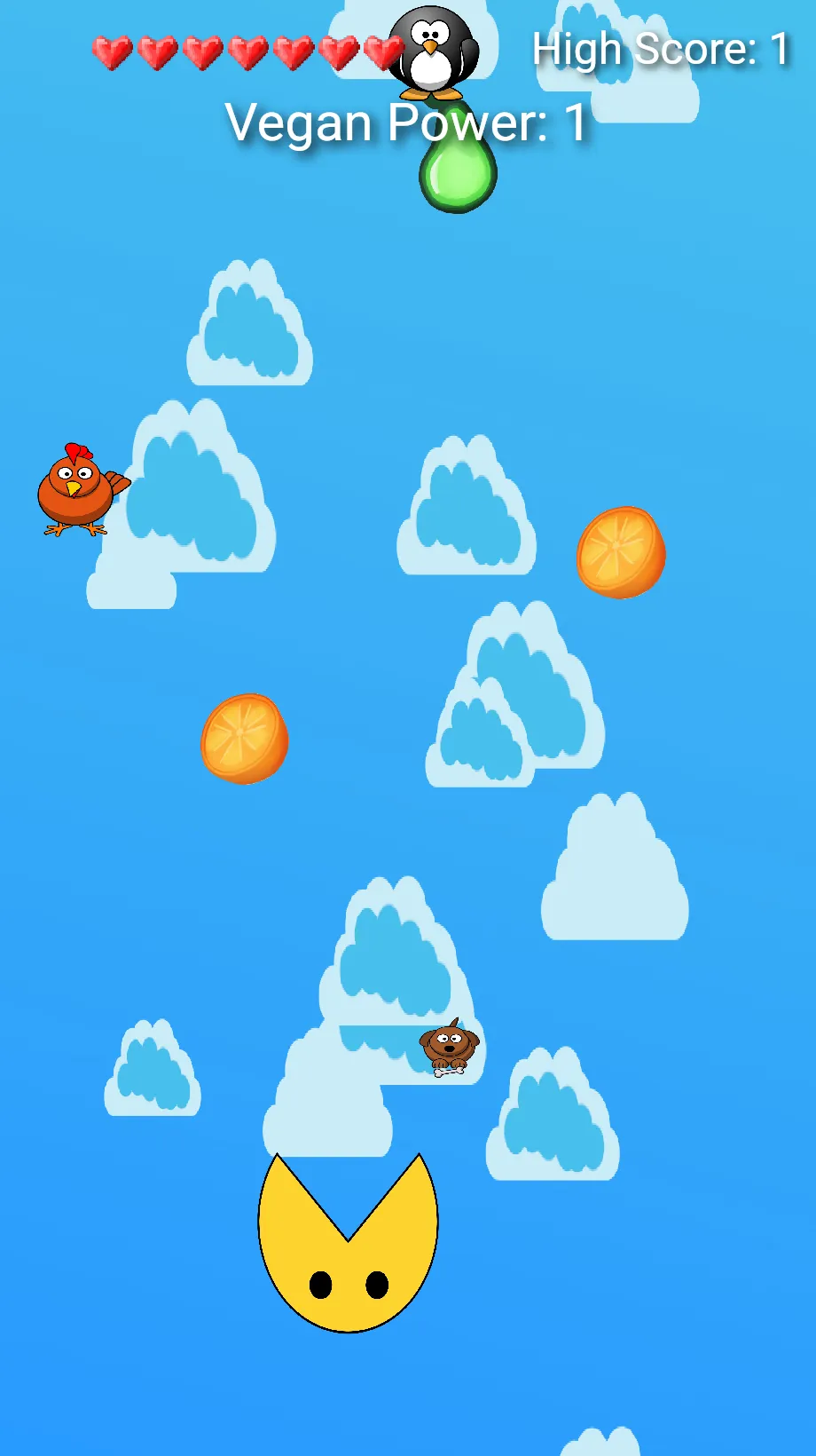 Vegan Power running in a browser tab on a phone-shaped screen: seven full hearts and the score line "Vegan Power: 1" across the top, a blue sky of cartoon clouds with two oranges and a pear falling through it, a chicken, a dog and a penguin drifting down among them, and the round yellow player waiting with its mouth open at the bottom of the play column.