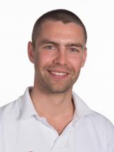 Image of Greg Nowak wearing a white shirt.